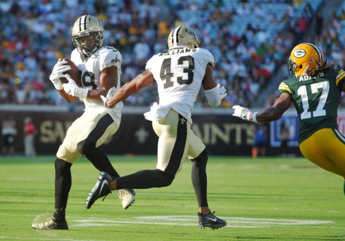 New Orleans Saints cornerback Paulson Adebo (29) intercepts a pass from Green Bay Packers quarterback Aaron Rodgers. Bob Self/Florida Times-Union via Imagn Content Services, LLC